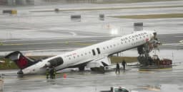 Air Canada aircraft on runway at LaGuardia Airport after collision causing flight delays