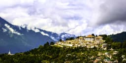Panoramic view of snow-capped Himalayan mountains and lush valleys in Tawang, Arunachal Pradesh